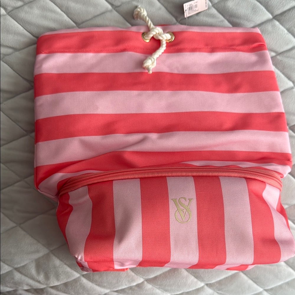 Striped Victoria’s Secret Pink and orange backpack with insulated pocket